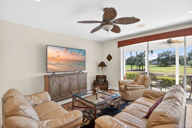 Photo - This 2 bedroom plus den, 2 bath condo with a one car garage offers expansive golf course and lake... Unit 4