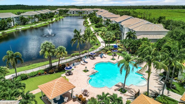 Enjoy breathtaking views of the lake and pool at Lexington Palms Apartment Homes. Our community offers resort-style amenities, beautifully landscaped grounds, and serene water features, creating a perfect retreat for relaxation and comfort. - Lexington Palms at the Forum Apartments