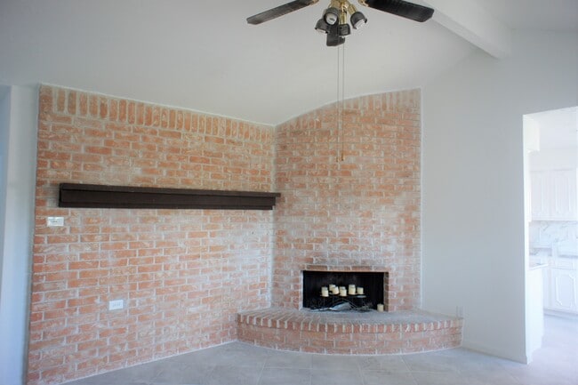 Den with a fireplace - 14910 Scotter Dr