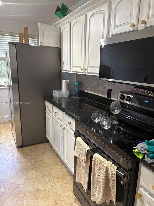 Photo - 8761 Wiles Rd Unit 301