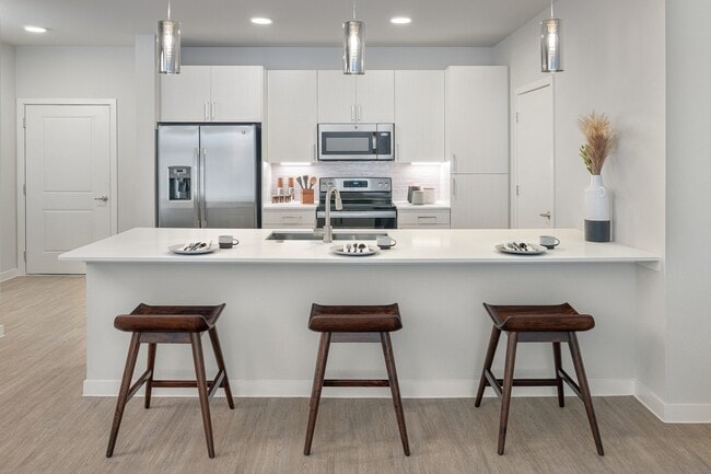 Stunning kitchens feature quartz countertops and subway tile backsplash