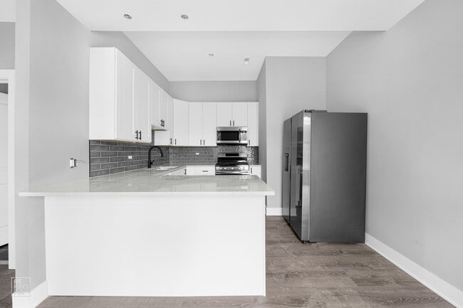 Building Photo - 1035 N Washtenaw Ave Unit #1