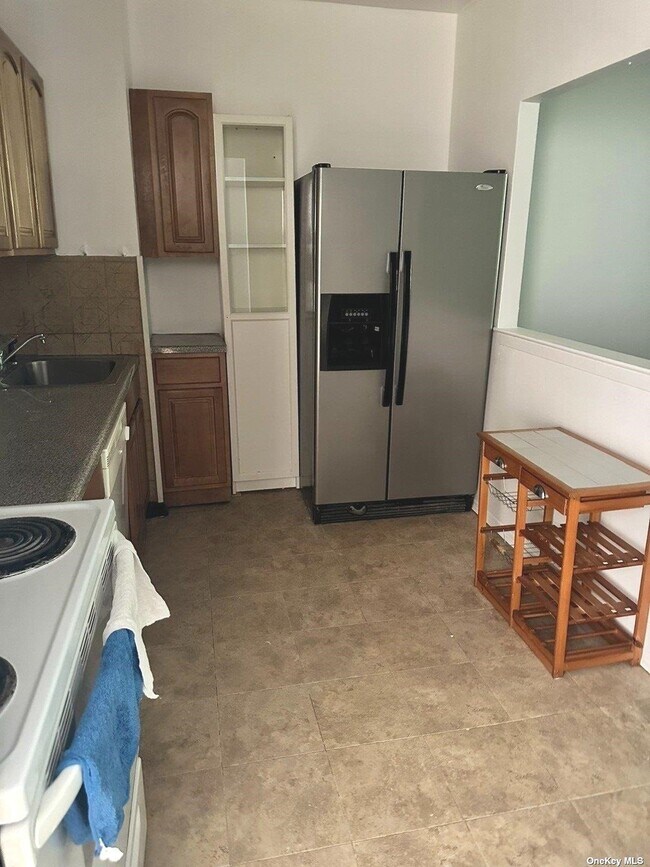 Photo - 13-35-35 Bell Blvd Unit 1 FL