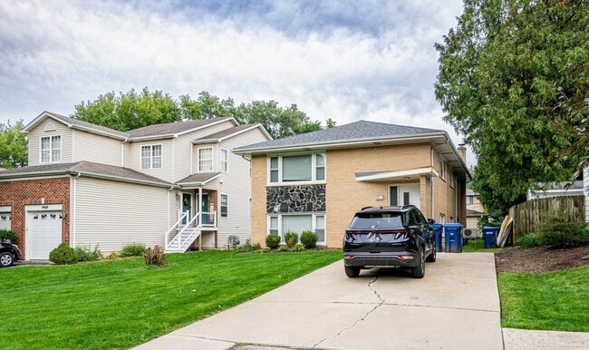 Building Photo - 4911 Spencer Ave Unit 1