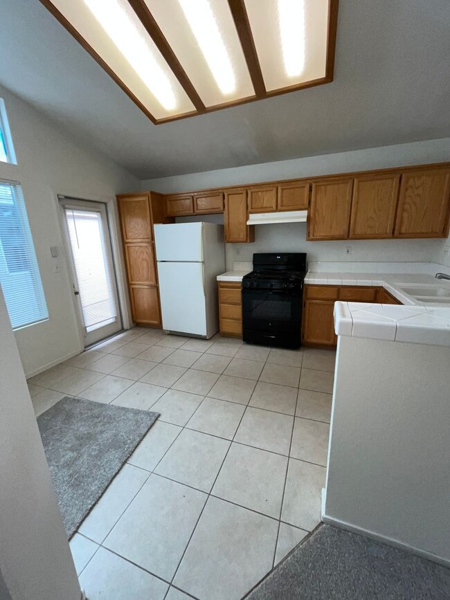 Photo - 3 Bed| 2 Bath | 1215 SF | Private Driveway + Garage | Single Story| Tenant pays $175 monthly for ...
