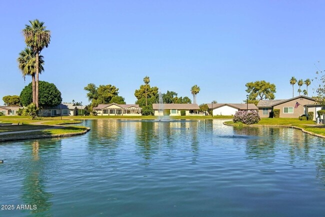 Building Photo - Welcome to this stunning updated 2-bedroom, 2-bathroom home on a lake located in the vibrant comm...