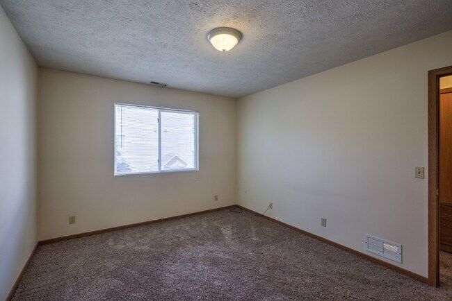 Large bedroom with carpet at Gretna Oaks.