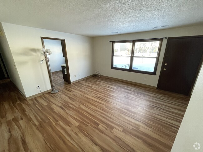 Entry to living room from common area/laundry room, into living room. - 717 Westgate St Unit Basement Rental