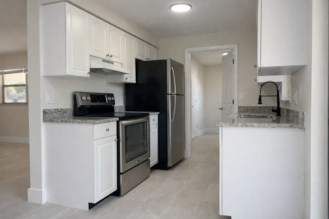 Photo - Beautifully Fully Remodeled 3-Bedroom Home with Carport, Indoor Laundry & Huge Fenced Yard!