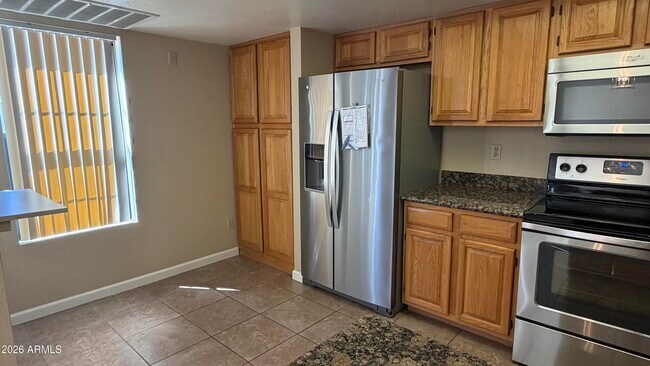 9750 N 94th Pl Unit 208