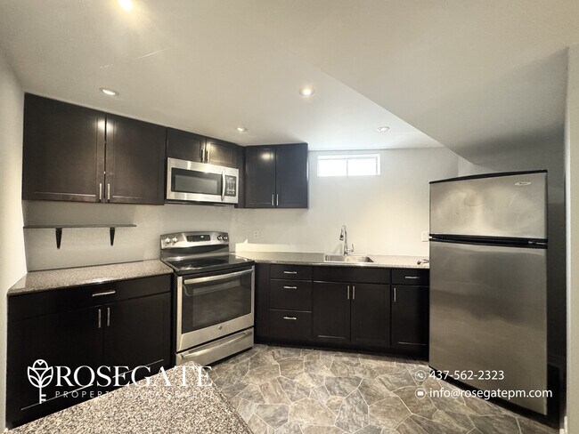 Photo - Bright 2-Bedroom Basement Apartment with P... Unit 2