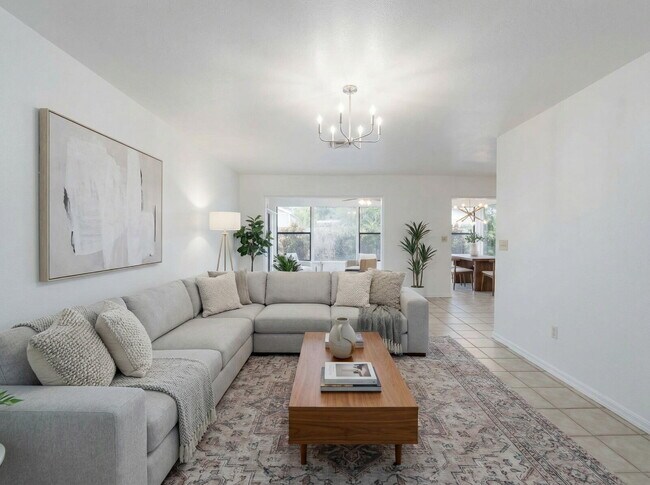 Photo - Recently painted 4BR/3BA home with tile floors throughout, fenced yard, detached garage, and prim...