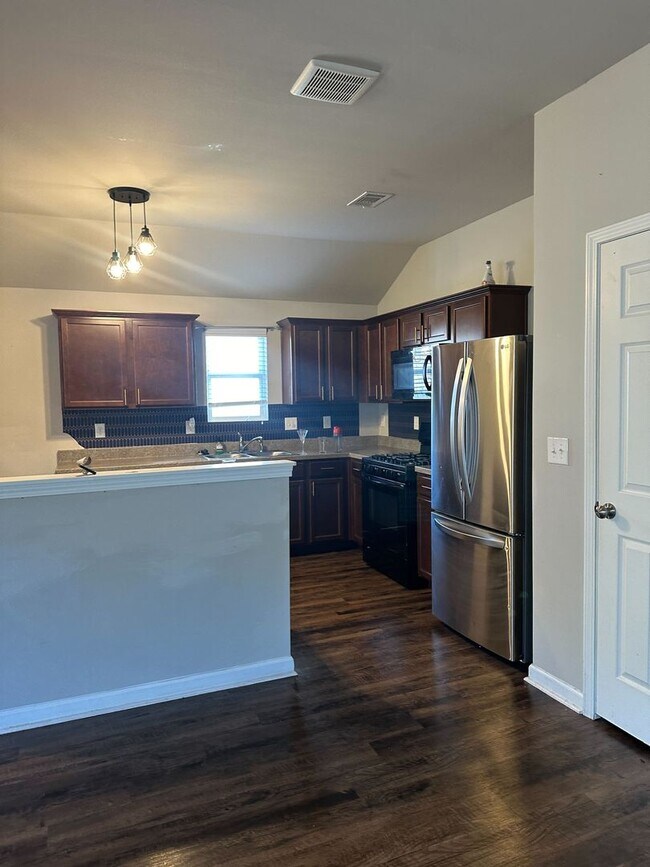 Photo - Stylish 4BR/2BA Home with Garage & Privacy Fence