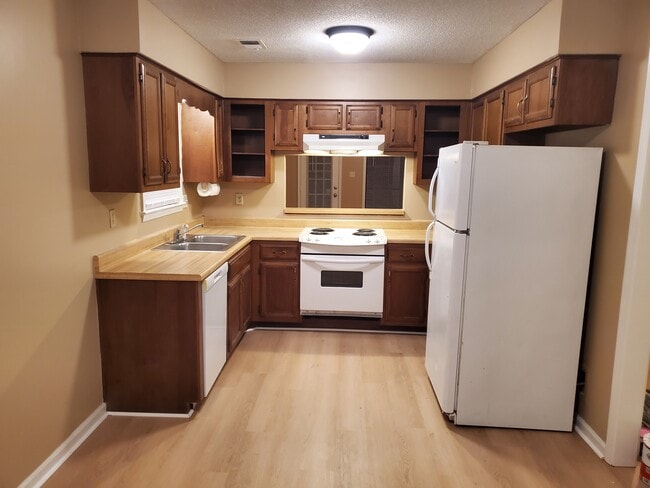 Fridge, dishwasher, disposal, built-in oven. Vent-a-hood vents outdoors. - 2284 Hometown Dr