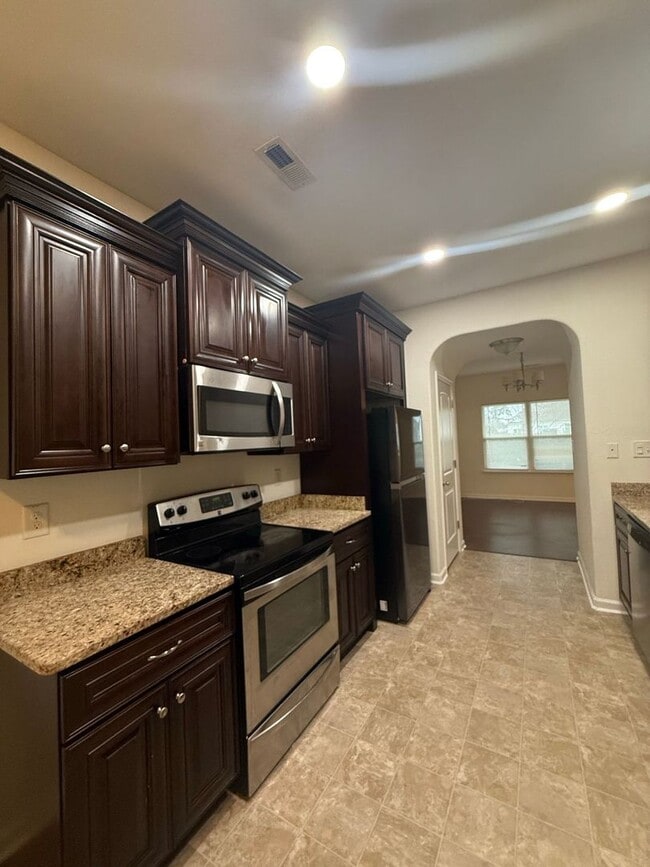 Photo - Spacious 4BR Home with Large Fenced Yard & Prime Location