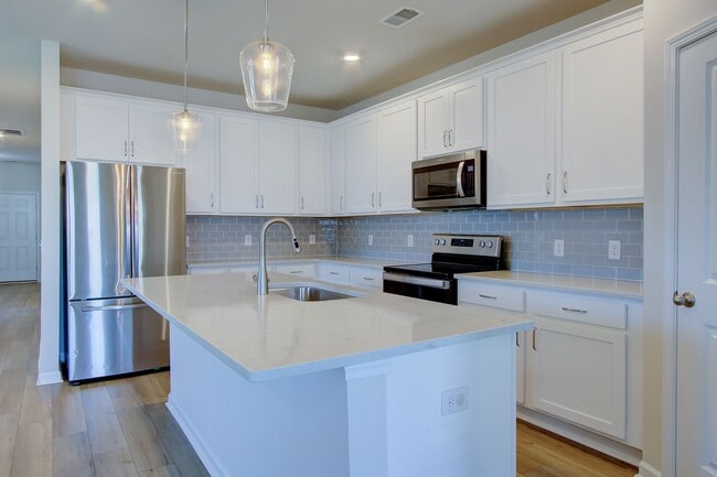 Photo - Spacious 4BR Rental with Stunning Kitchen & Covered Patio