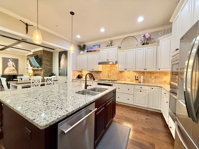 Photo - Luxurious 3BD, 4BA Raleigh Townhome with a First Floor Master Bedroom, Bonus Sunroom, and Large U...