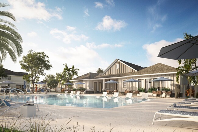 With its expansive sundeck, lounge seating, and umbrellas, the resort-style pool provides a luxurious oasis for residents to enjoy. - Amavi Kissimmee Townhomes