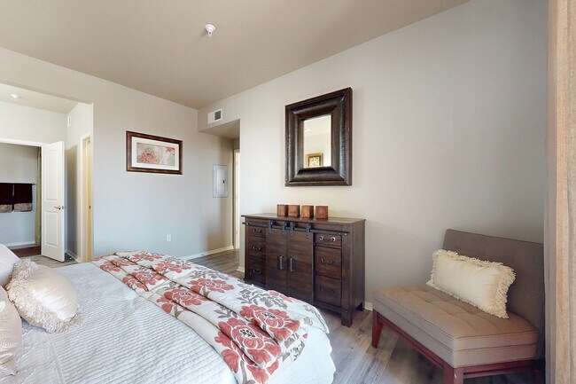 Experience tranquility in this elegantly styled bedroom, featuring tasteful decor and inviting comfort. - Las Mananitas Apartments