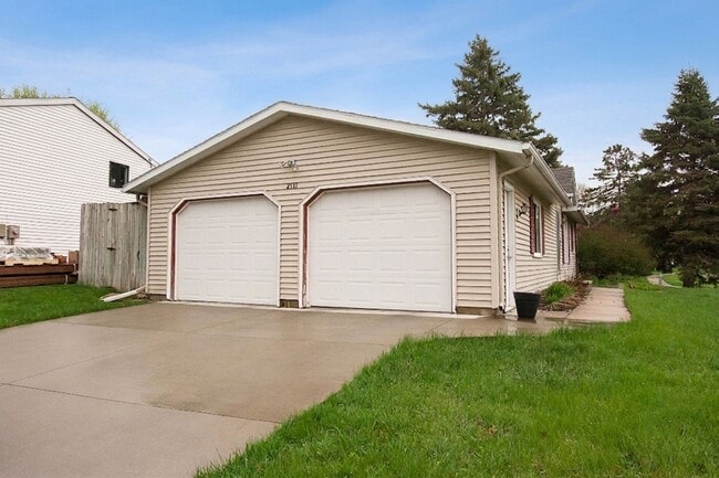 Photo - Ranch-style home with great fenced yard & patio!
