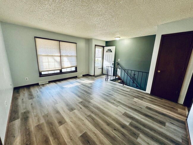 Photo - {1809} Spacious Duplex in Great Blue Springs Location + Finished Basement + 1 Car Garage