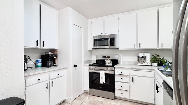 Photo - Fantastic 4 bedroom home with a 1 car garage and driveway space for additional car! Backyard and ...