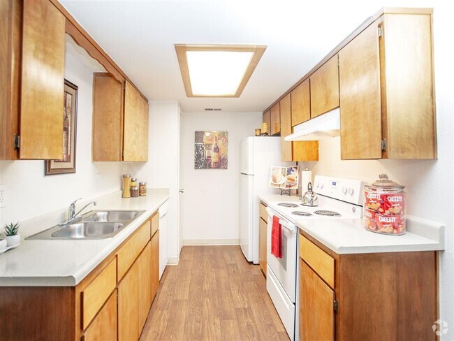 Modern Kitchen With Custom Cabinet - Courtyard at Central Park Apartments