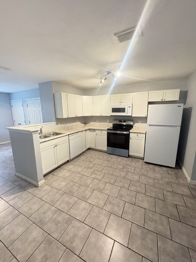 Open floor plan, four-bedroom two-bathroom with washer and dryer