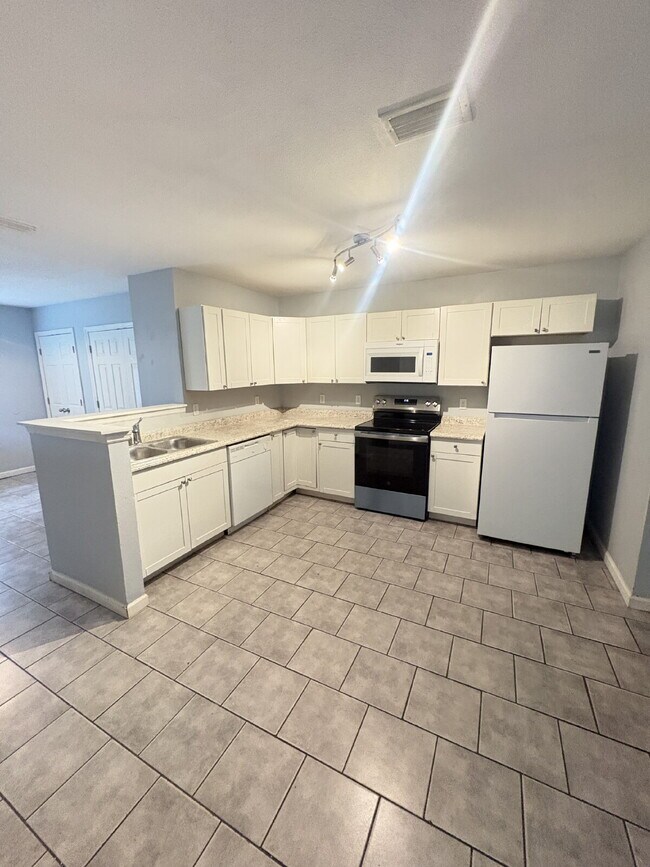 Photo - Open floor plan, four-bedroom two-bathroom with washer and dryer Unit 2