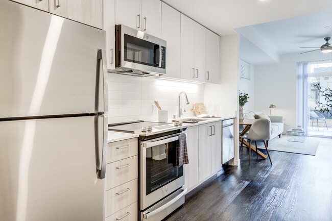 Our chef inspired kitchens feature designer finishes and stainless-steel appliances. - Windsor Totem Lake Apartments