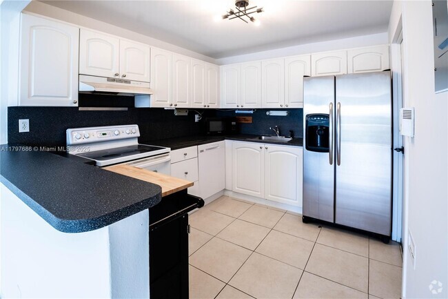 Building Photo - 1220 71st St Unit 46 Rental