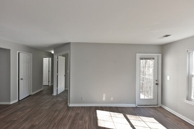 Spacious living room with hardwood-style flooring