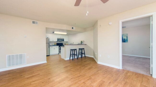 Revel in the airy openness of our floor plans accentuated by sleek wood-style flooring.