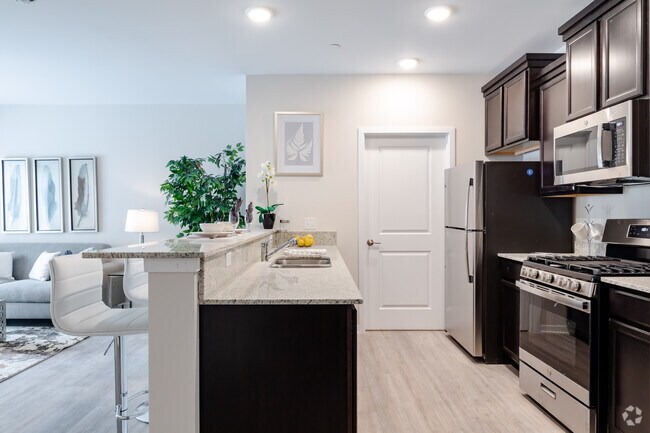 1BR 1BA + Den - 913SF