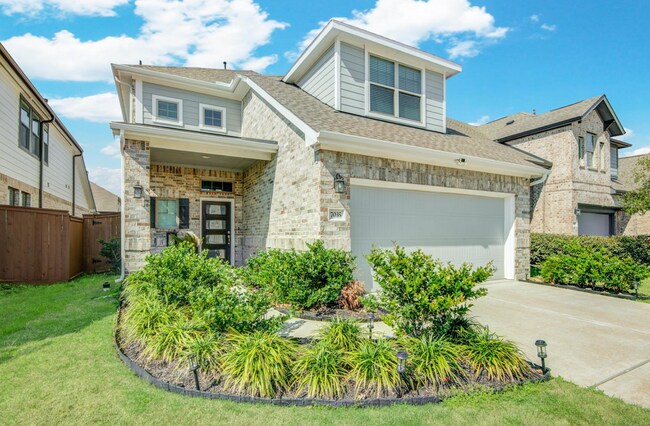 Precioso jardín delantero. - 7035 Coneflower Creek Ct
