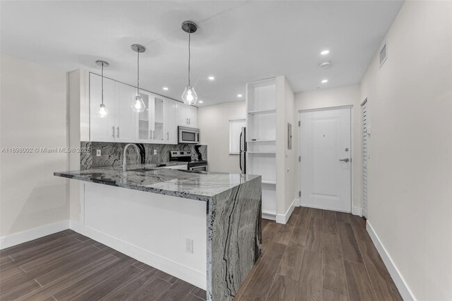 Building Photo - 7707 Camino Real Unit B205
