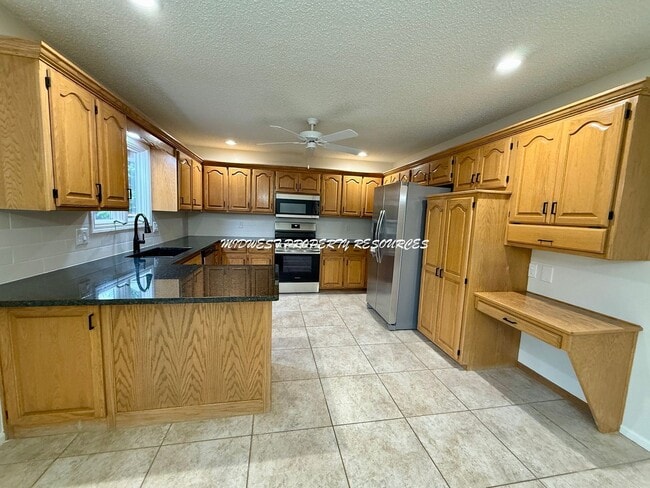 Photo - Spacious 3 Bedroom Home with Finished Basement, Covered Deck & Fenced Yard