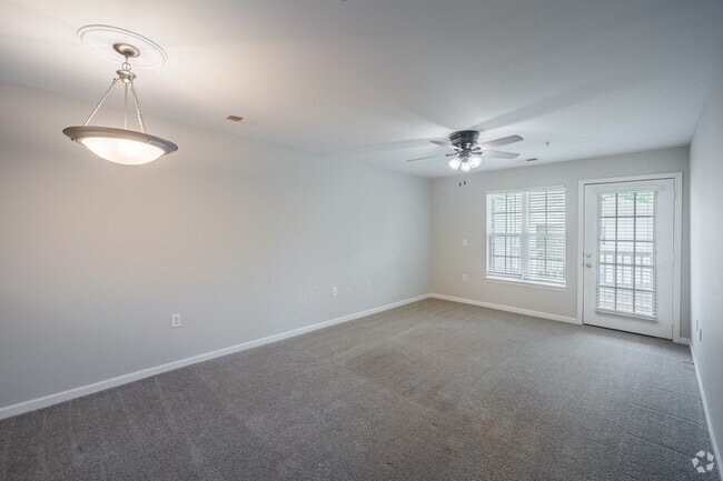 2BR, 2BA - 1,023SF - Living Room and Dining Room