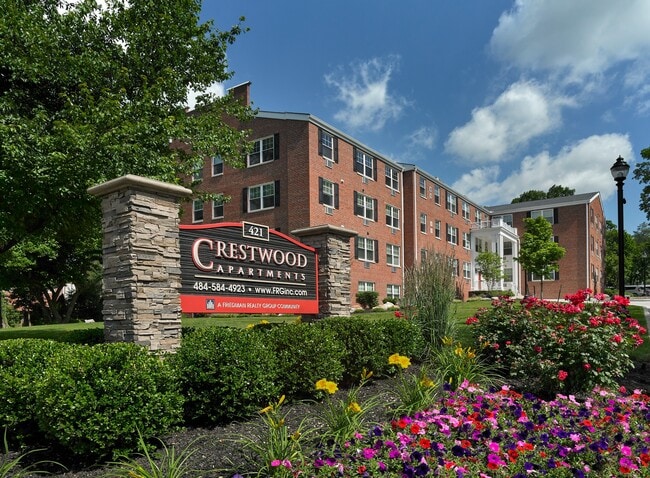 Vibrant landscaping and welcoming signage at Crestwood Apartments in Wayne, PA