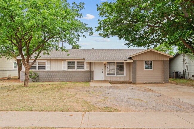 Building Photo - Updated Home with Gorgeous Floors & Large Backyard