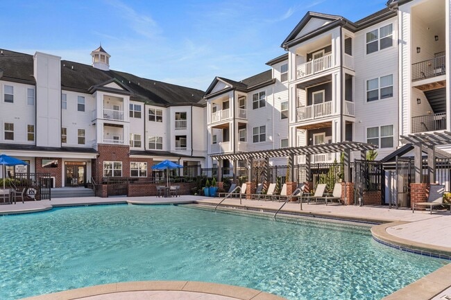Soak in the sun at our expansive saltwater swimming pool with outdoor TV and cabana