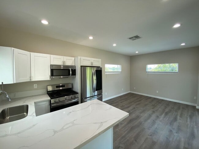 Photo - NEW (2023) 4BD/2BA!! Back gate exits right...