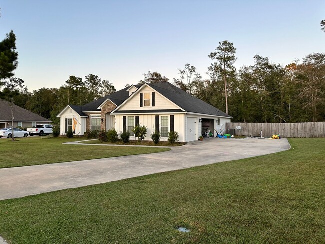 Photo - Spacious 4BR/3BA Home with 3-Car Garage, Fireplace & Fenced Yard in Knights Mill