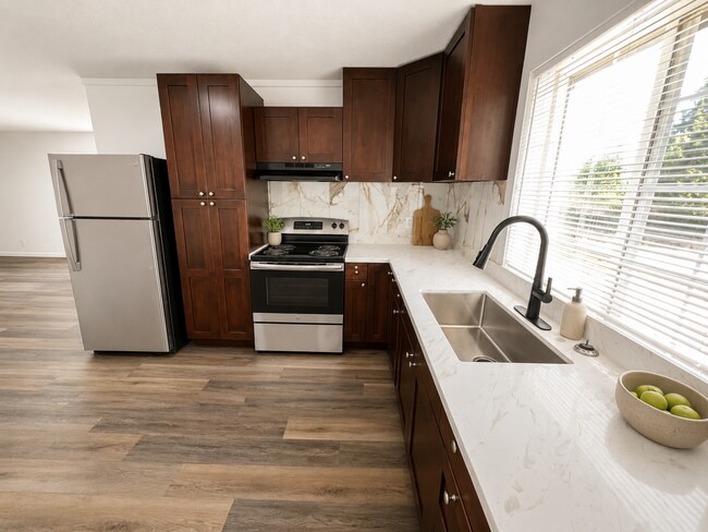 Photo - Elevated 3-Bedroom Home with Secure Garage & Cozy Living Space Unit C