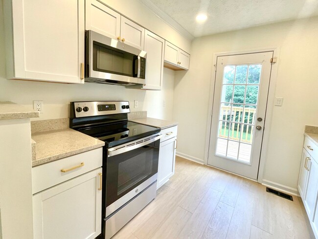 Photo - Beautifully updated, multi-level condo in ...