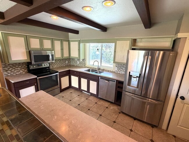 Photo - Pet Friendly 2 bed 1/5 bath Single Family Home With Fully Fenced Yard and Garage in great neighbo...
