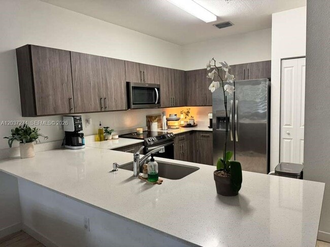Building Photo - 15540 SW 136th St Unit 4-101