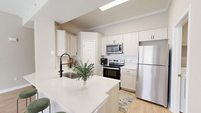 Newly Renovated Kitchen with Stainless Steel Appliances - Lakeside at Coppell Apartments