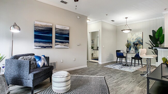 Our apartment homes offer open-concept living, seamlessly connecting living, dining, and kitchen spaces. - Elevate 155 Apartments