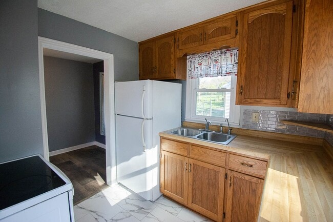 Photo - Fenced Yard, 2-Car Garage + Quiet Location!
